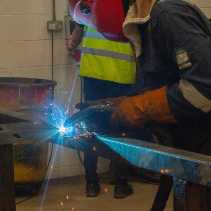 Welder using BEAM On torch weld fume extraction system while welding