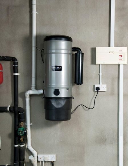 Central vacuum unit installed in plant room of new build home